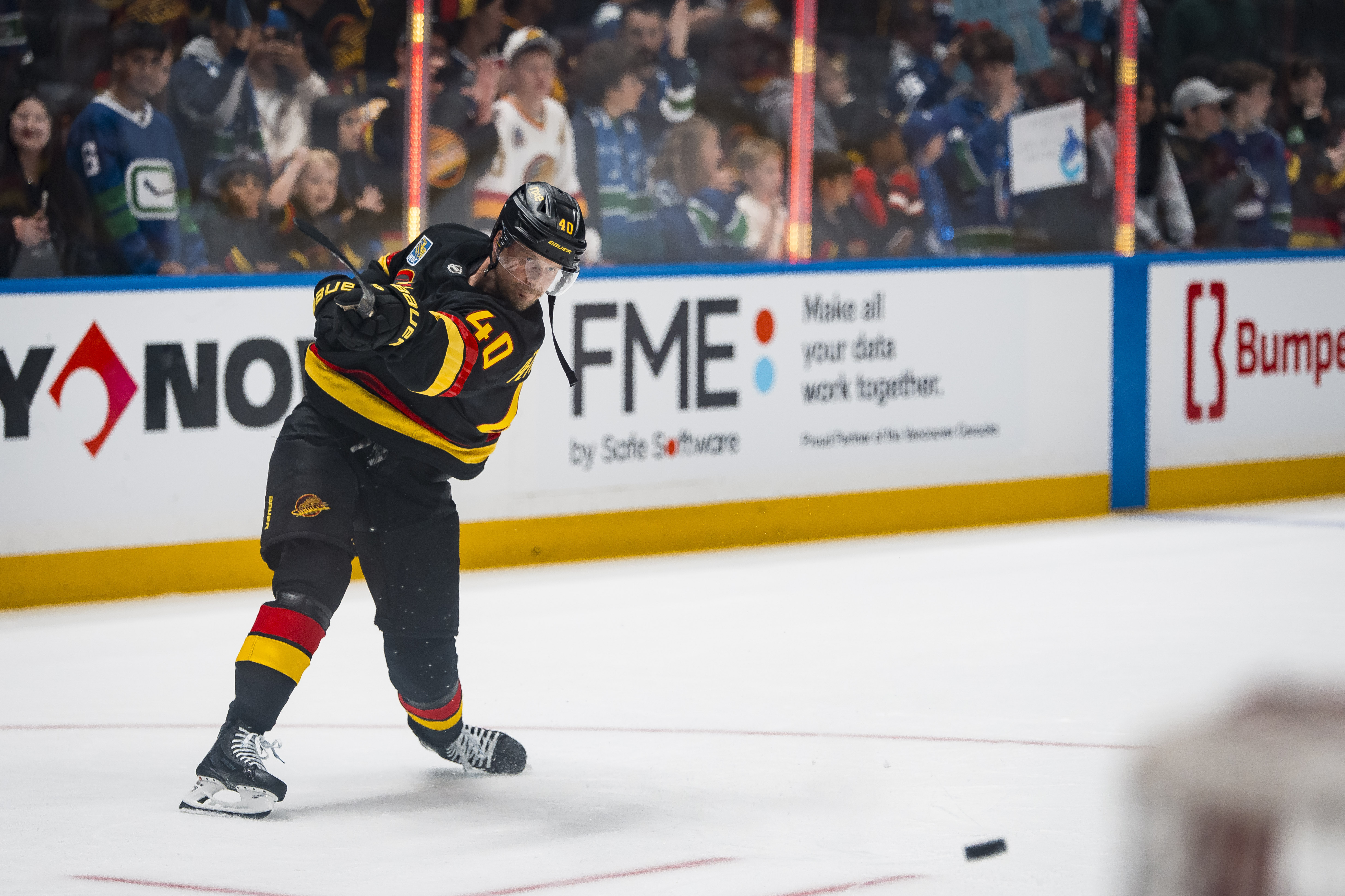 Canucks Beat Flames 4-1 With Four-Goal Third Period
